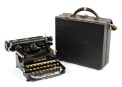 An early 20th century Corona travel typewriter with case