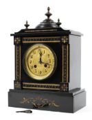 A French black slate mantle clock with gilt detail, gilt brass face and Arabic markers,