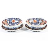 A pair of Japanese imari pattern bowls and a pair of small dishes or stands, late 19th century,