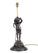 A Victorian style bronzed table lamp, cast as a putti supporting a single light,