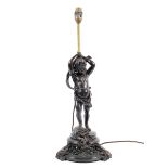 A Victorian style bronzed table lamp, cast as a putti supporting a single light,