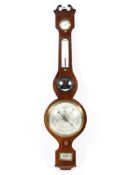 A Victorian mahogany banjo barometer, with silvered dials.