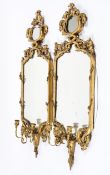 A pair of Georgian-style giltwood girandole mirrors, probably 19th century with later additions,