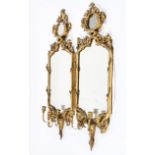 A pair of Georgian-style giltwood girandole mirrors, probably 19th century with later additions,