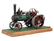 A metal model of Allchin steam traction engine on wooden plinth base,