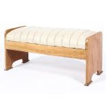 A retro teak white leather mounted rectangular stool, on arched rectangular side supports