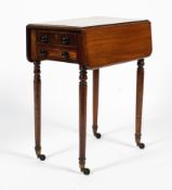 An early 19th century mahogany drop-leaf work table, with two drawers, one with compartments,