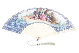 A French ivory and painted vellum fan, the vellum printed and painted with a fete gallantes,