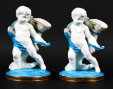 A pair of English porcelain putti posy vases, circa 1880, probably Minton or Moore Bros,