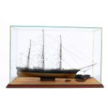 A glass cased scratch built model of 'The Cutty Sark' a three mast sailing ship with small piece of
