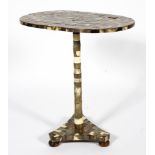An early 20th century horn veneered oval occasional table of oval form,