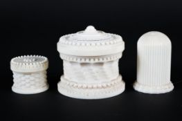Three Victorian turned and carved ivory boxes, each of cylindrical form,