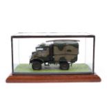 A glass cased model of a military vehicle,