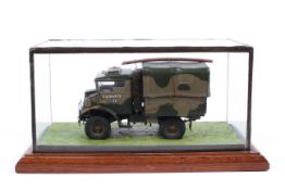 A glass cased model of a military vehicle,