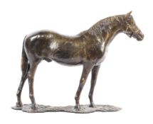 A contemporary bronze sculpture of a racehorse,