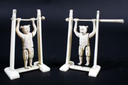 A pair of Chinese ivory and bone figures of carved acrobats, late 19th century,