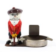 An early 20th central painted cast metal golfers ashtray,