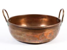 A Victorian copper two-handled pan, with loop handles