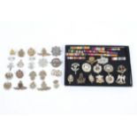 A Collection of military cap badges and ribbons,