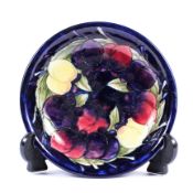 A Moorcroft Leaf and Berry pattern plate, 20th century, painted and impressed marks,