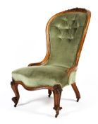 A Victorian carved walnut framed upholstered balloon back chair,
