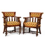 A pair of carved oak upholstered armchairs, late19th/early 20th century,