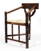 A late 19th century oak bobbin turned corner chair,