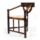 A late 19th century oak bobbin turned corner chair,