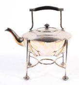 A Christopher Dresser style silver plated tea kettle and cover on stand by Mappin and Webb,