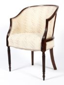 A 19th century mahogany reeded tub chair, upholstered in cream fabric, on tapering reeded legs,