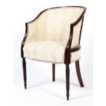 A 19th century mahogany reeded tub chair, upholstered in cream fabric, on tapering reeded legs,