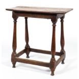 An 18th century oak stool,