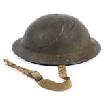 A British WWII Brodie style helmet, stamped ' 'AMC II/1941' to underside,