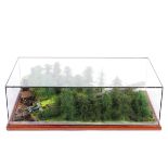 A glass cased military diorama of a German V1 Doodlebug launch site, in naturalistic forested scene