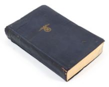 A 1943 copy of Mein Kampf by Adolf Hitler in blue cloth binding with swastika and eagle emblem.