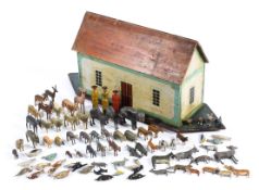 A late 19th/early 20th century painted wooden Noah's ark with a collection of wooden animals,