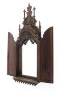 An English Victorian carved walnut Gothic wall mirror,