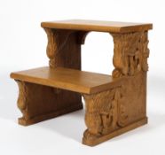 A set of contemporary carved oak steps, two tiered,