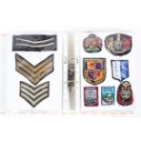 A collection of approximately 160 military and police cloth badges and others,