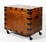 A large early 20th century oak and metal bound canteen chest, bearing a brass plaque.