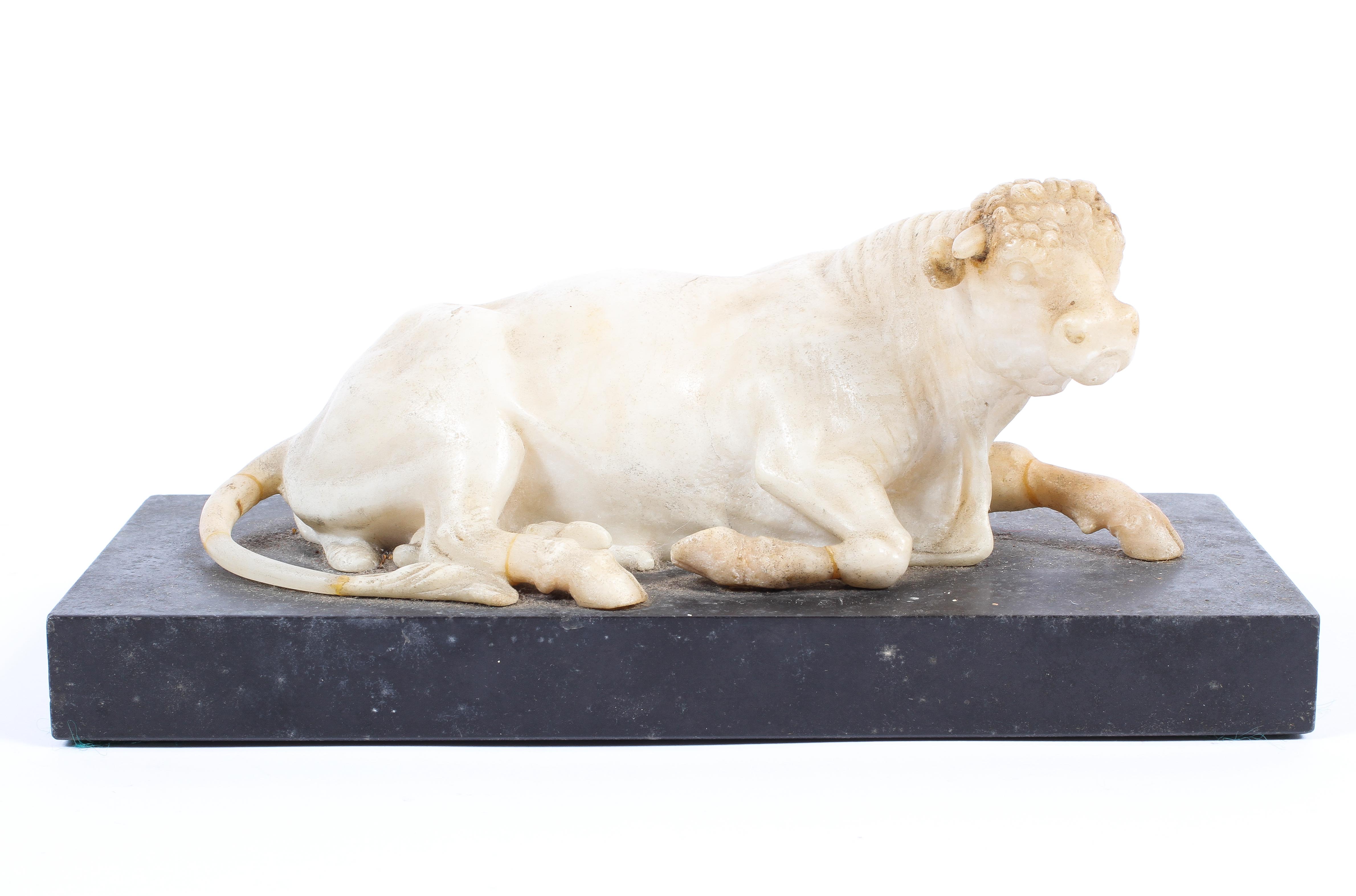 A 19th century carved alabaster model of a recumbent bull, perhaps by Joseph Hall Marble Works,