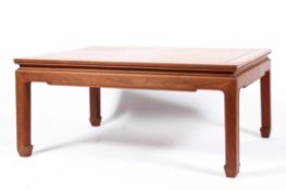 A Chinese teak rectangular coffee table, 20th century, with moulded top and shaped square legs,