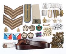 A collection of assorted 20th century military buttons and cloth badges and shoulder stripes