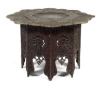 An Indian carved hardwood folding tray table,