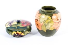 A Moorcroft Hibiscus pattern vase and a bowl and cover, painted and impressed marks,