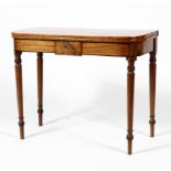 A 19th century mahogany flip top table with black banded inlay raised on turned legs,