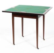 A Regency mahogany envelope games table, inlaid with satinwood stringing,