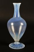 A wrythen moulded oviform opaline glass bottle vase in the manner of James Powell & Sons,
