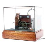 An electrified cased military diorama scene of an injured veteran in a glass case on wooden plinth