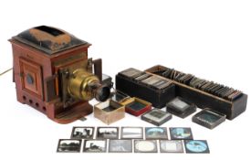 A magic lantern projector with a large collection of glass slides, with images of London,